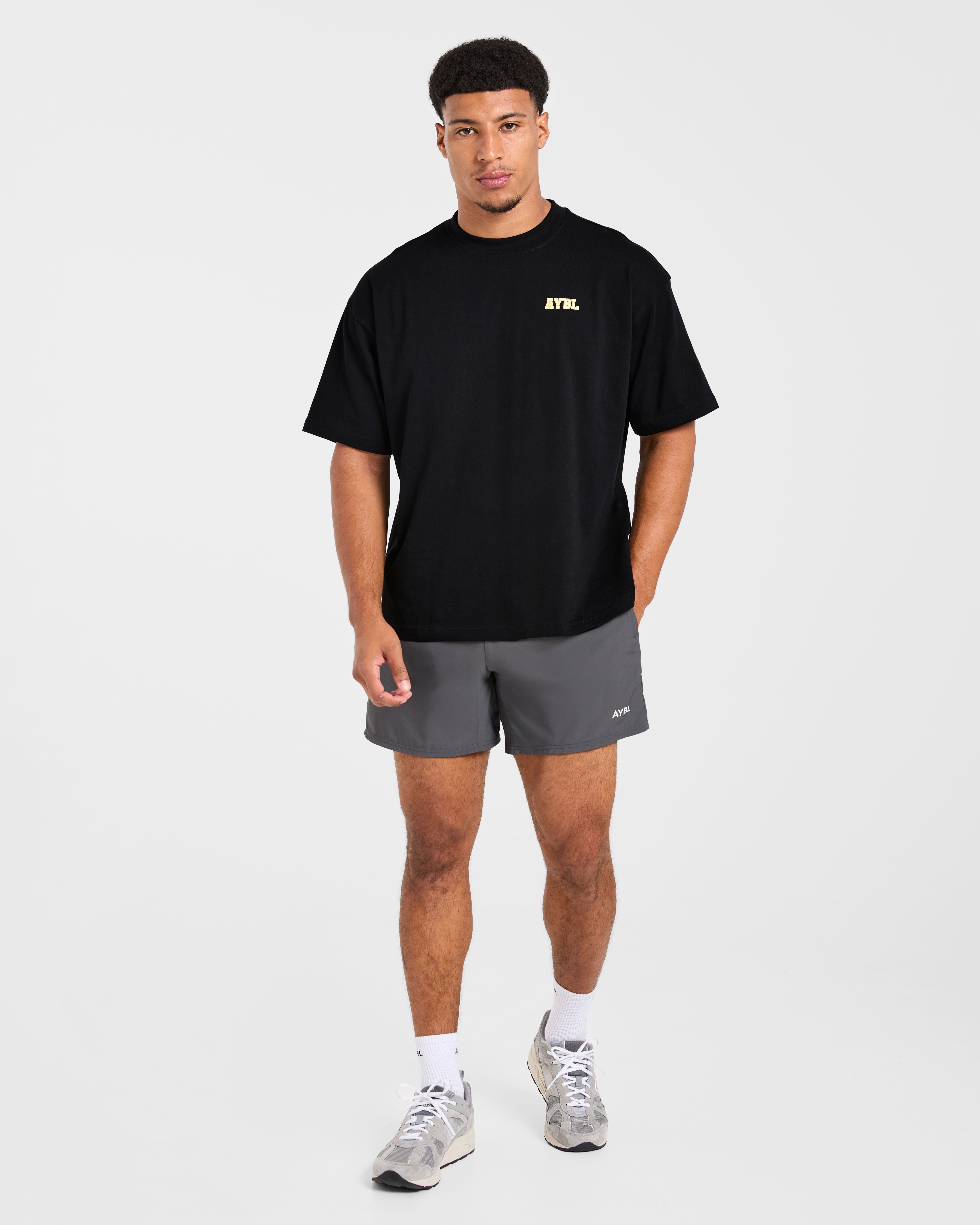 Power In Motion Oversized T Shirt - Zwart/Geel