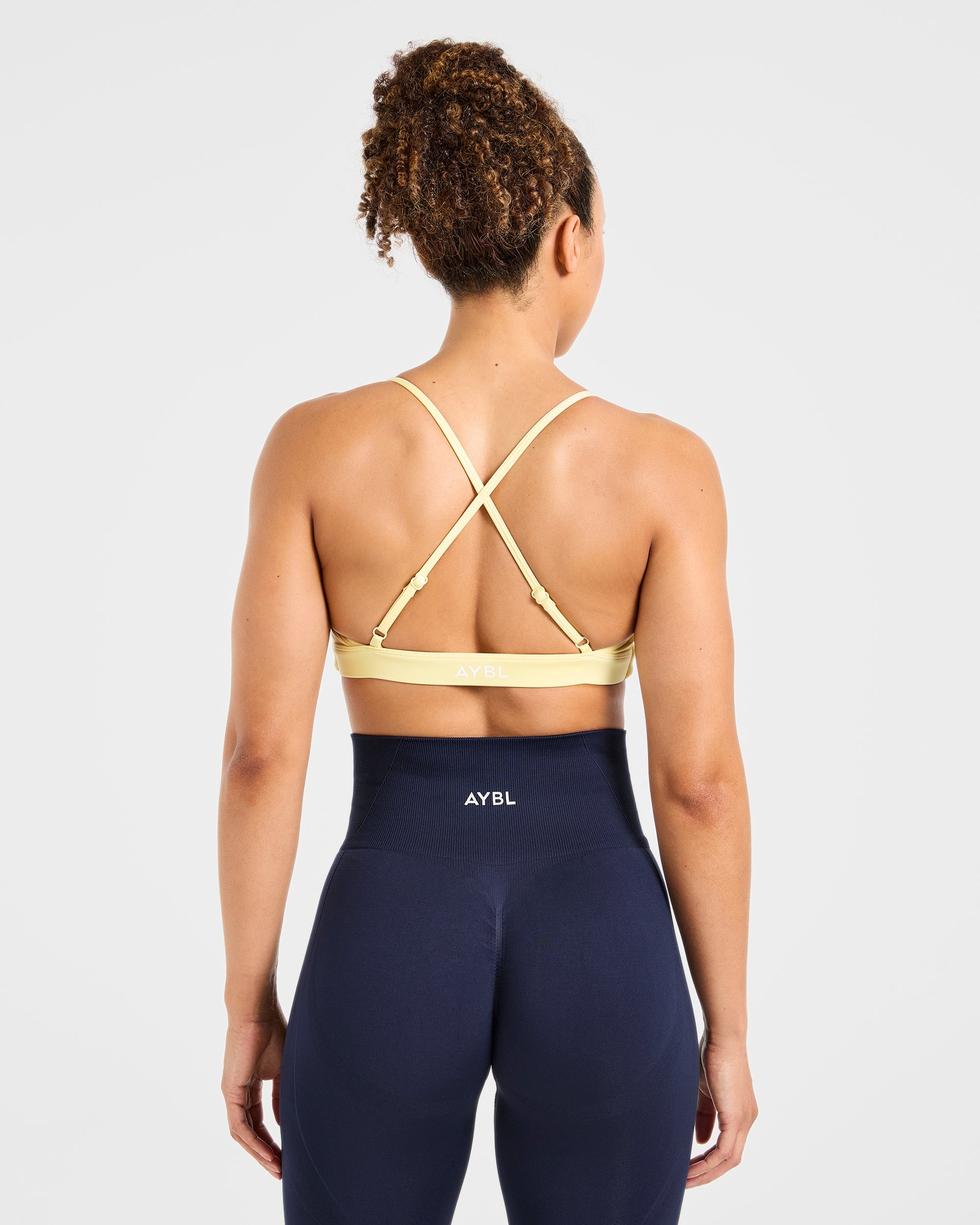 Essential Twist Crossback Sports Bra - Geel