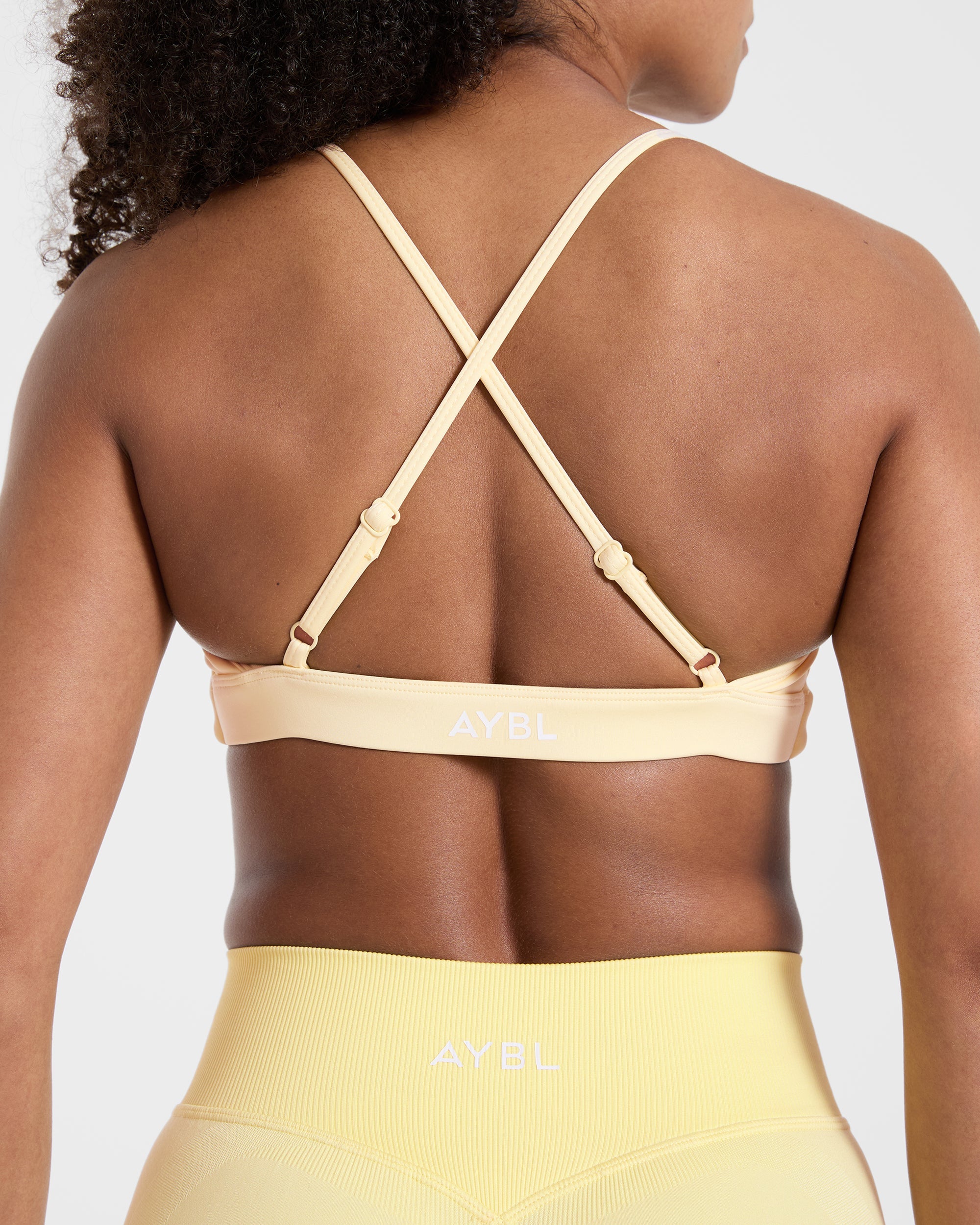 Essential Twist Crossback Sports Bra - Geel