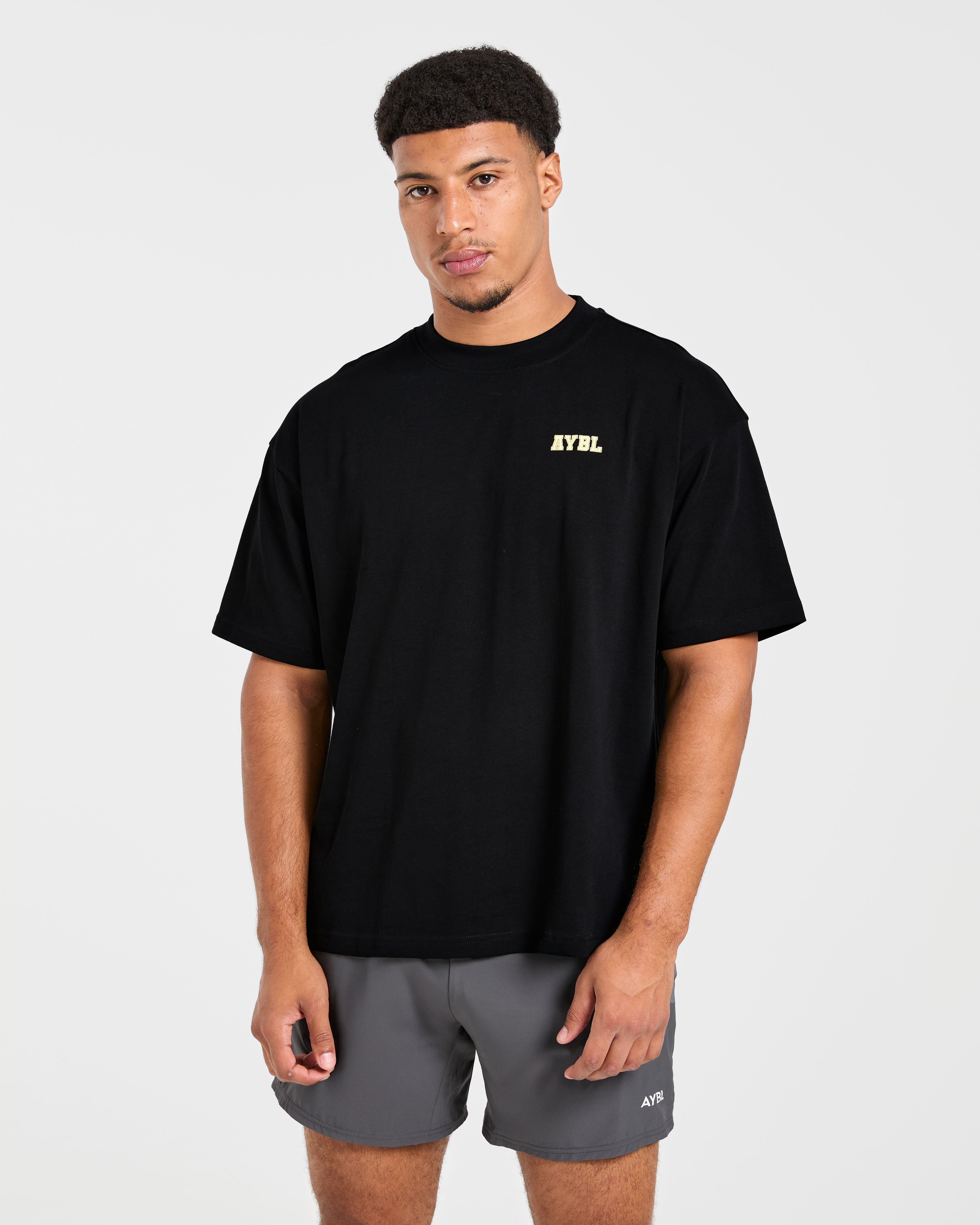 Power In Motion Oversized T Shirt - Zwart/Geel
