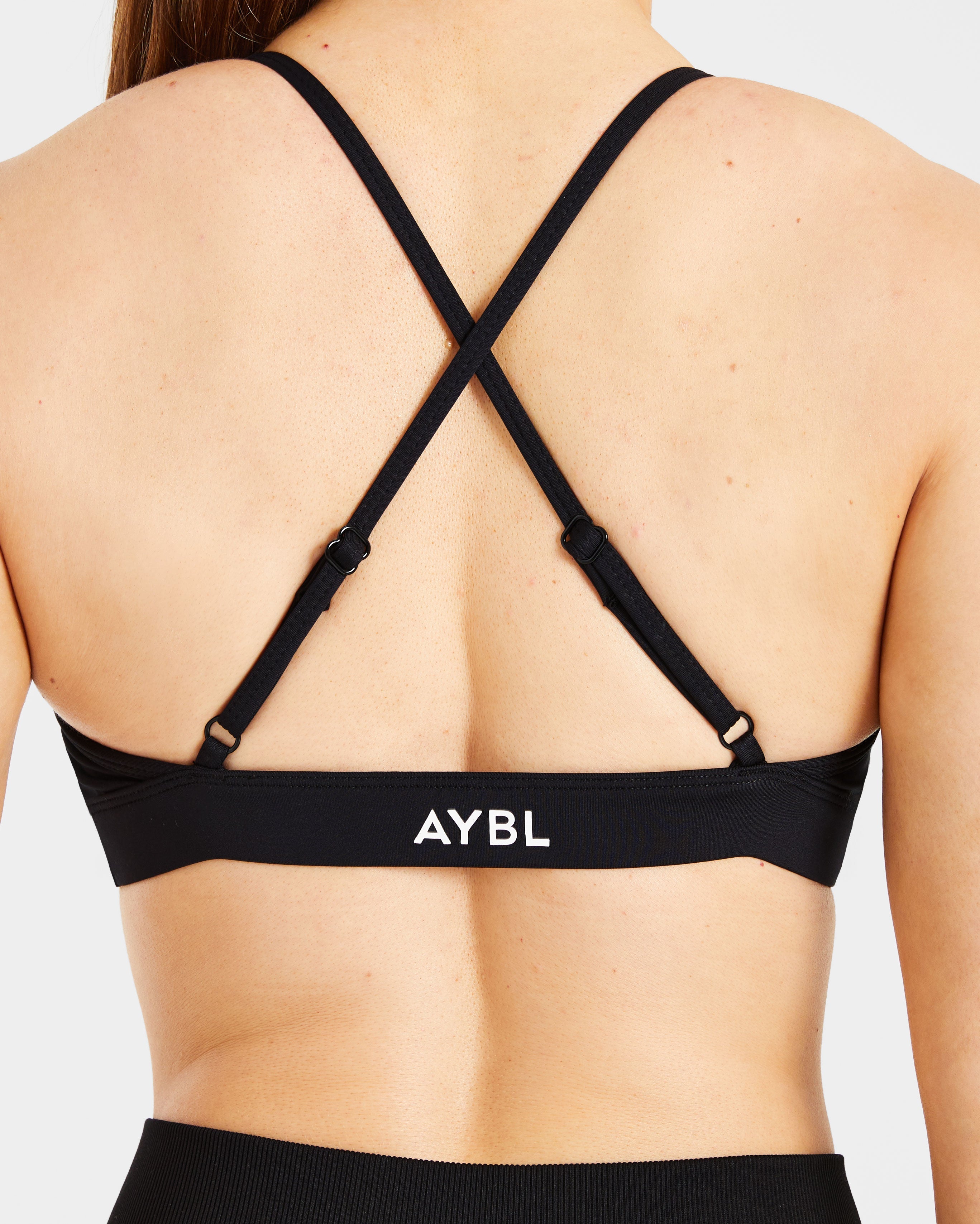 Essential Twist Crossback Sports Bra - Zwart
