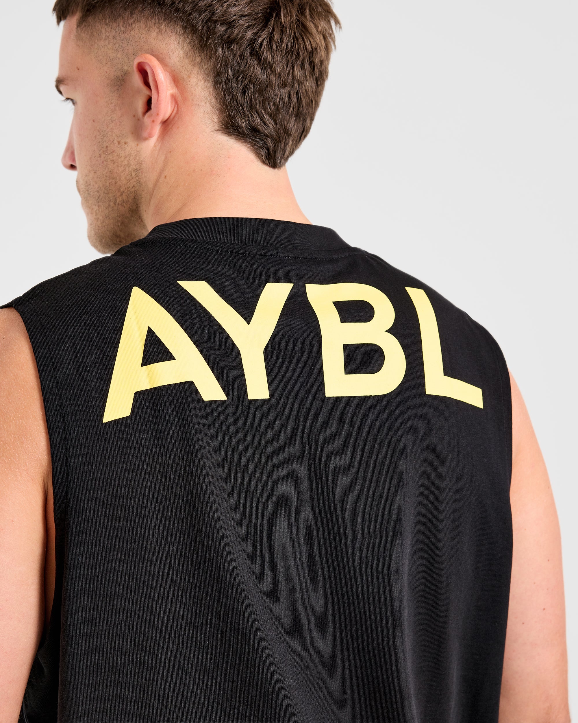 Essential Oversized Graphic Tank - Zwart/Geel